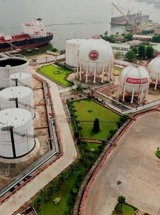 Aerial view of a coastal tank farm and industrial waterfront